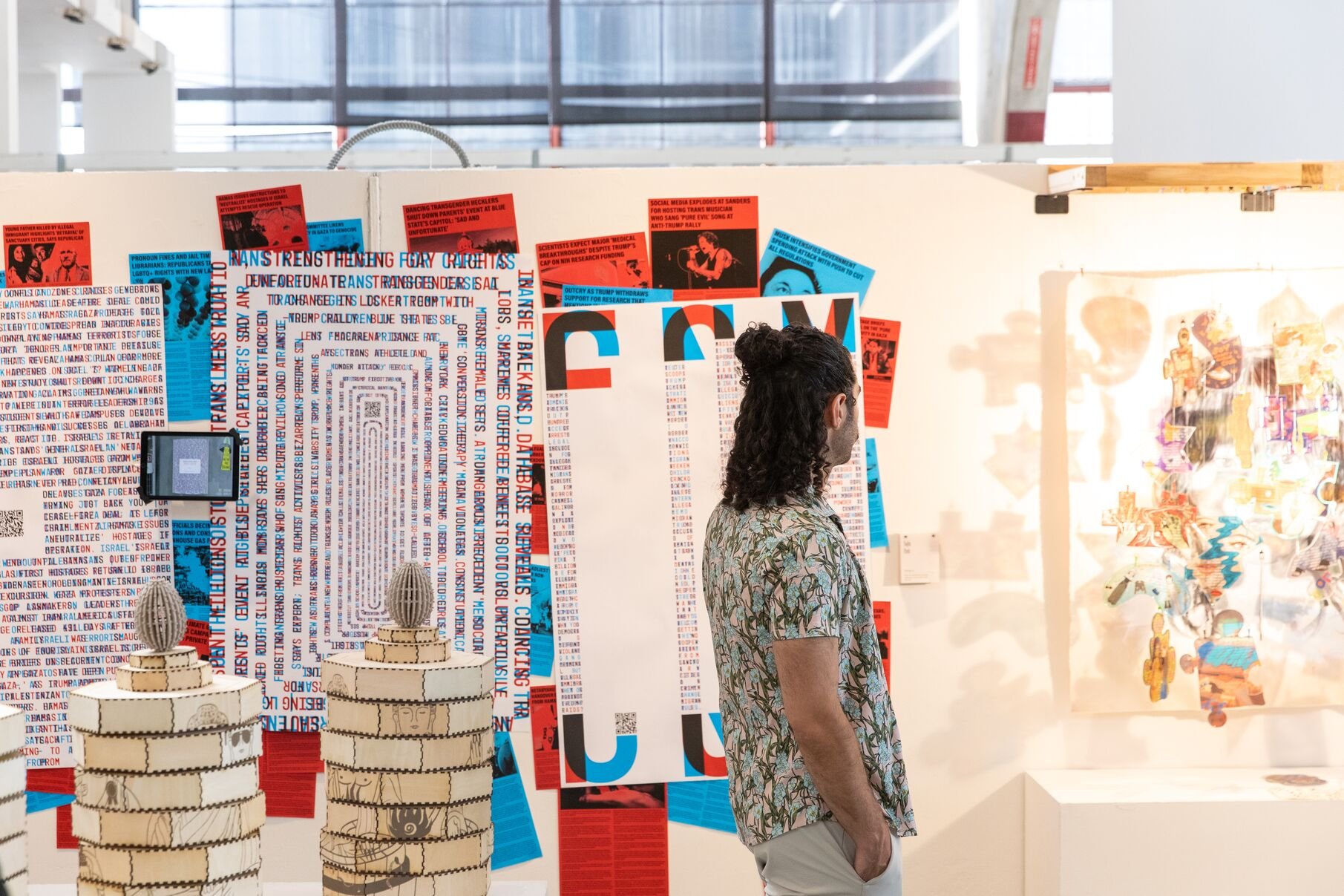 A typographic grid composition exploring trans identity and visibility, displayed at the Resist: BFA Graphic Design Senior Show, Spring 2025.