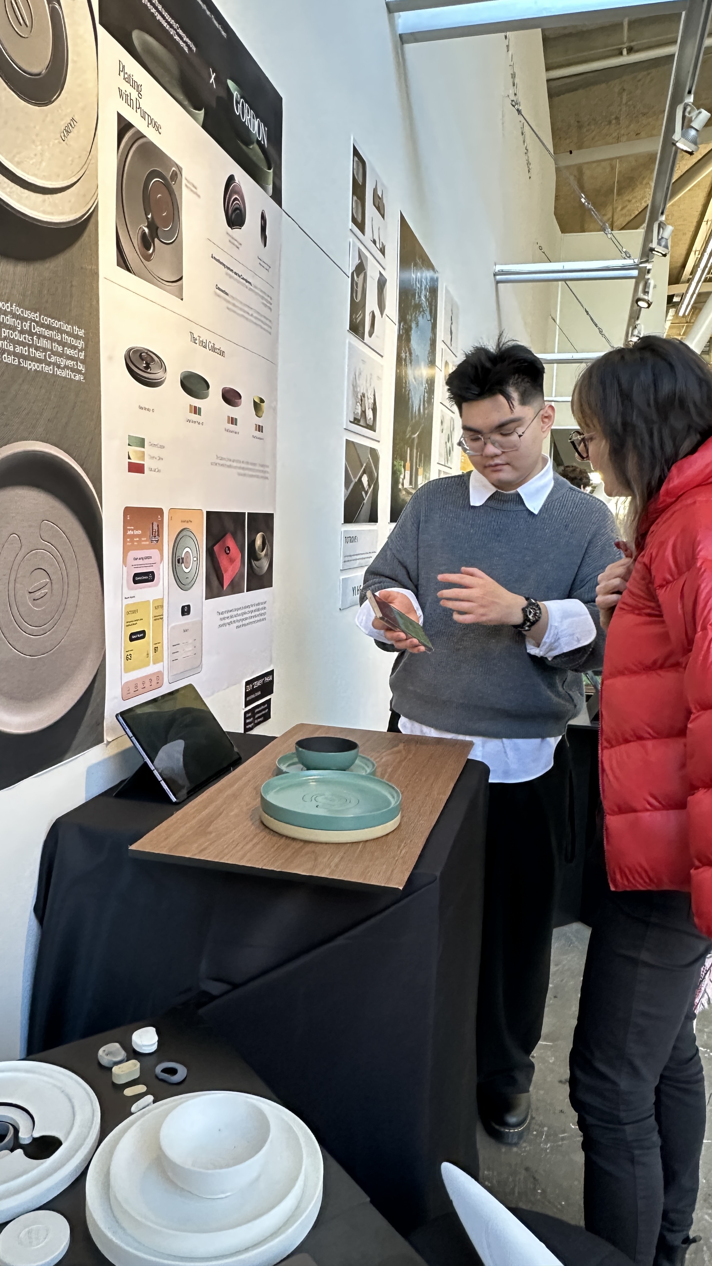A student's industrial design thesis project displayed at the BFA Industrial Design Senior Show, with presentation materials and prototypes.