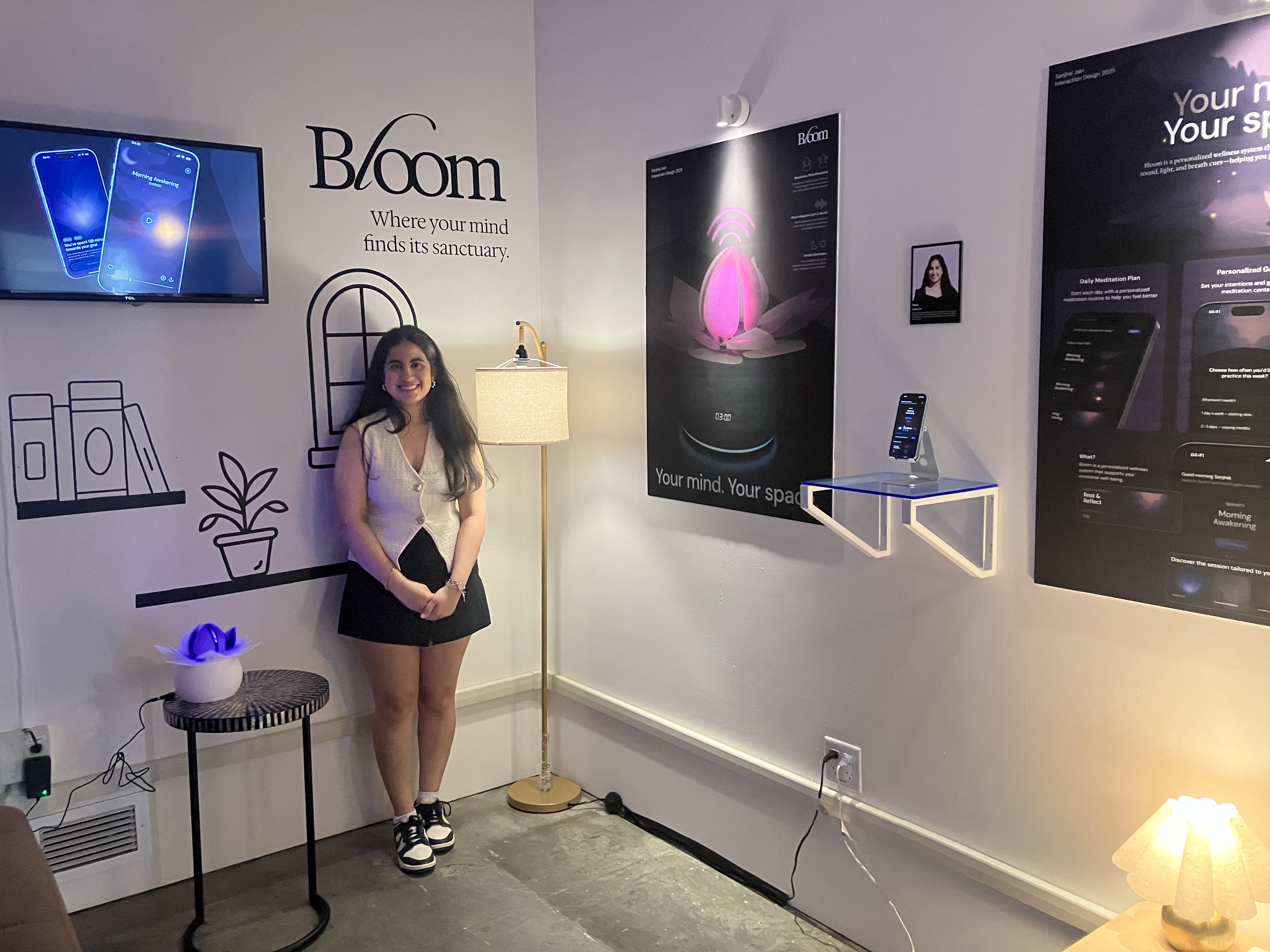 Visitors engage with a student thesis project at the BFA Interaction Design showcase, Spring 2025.